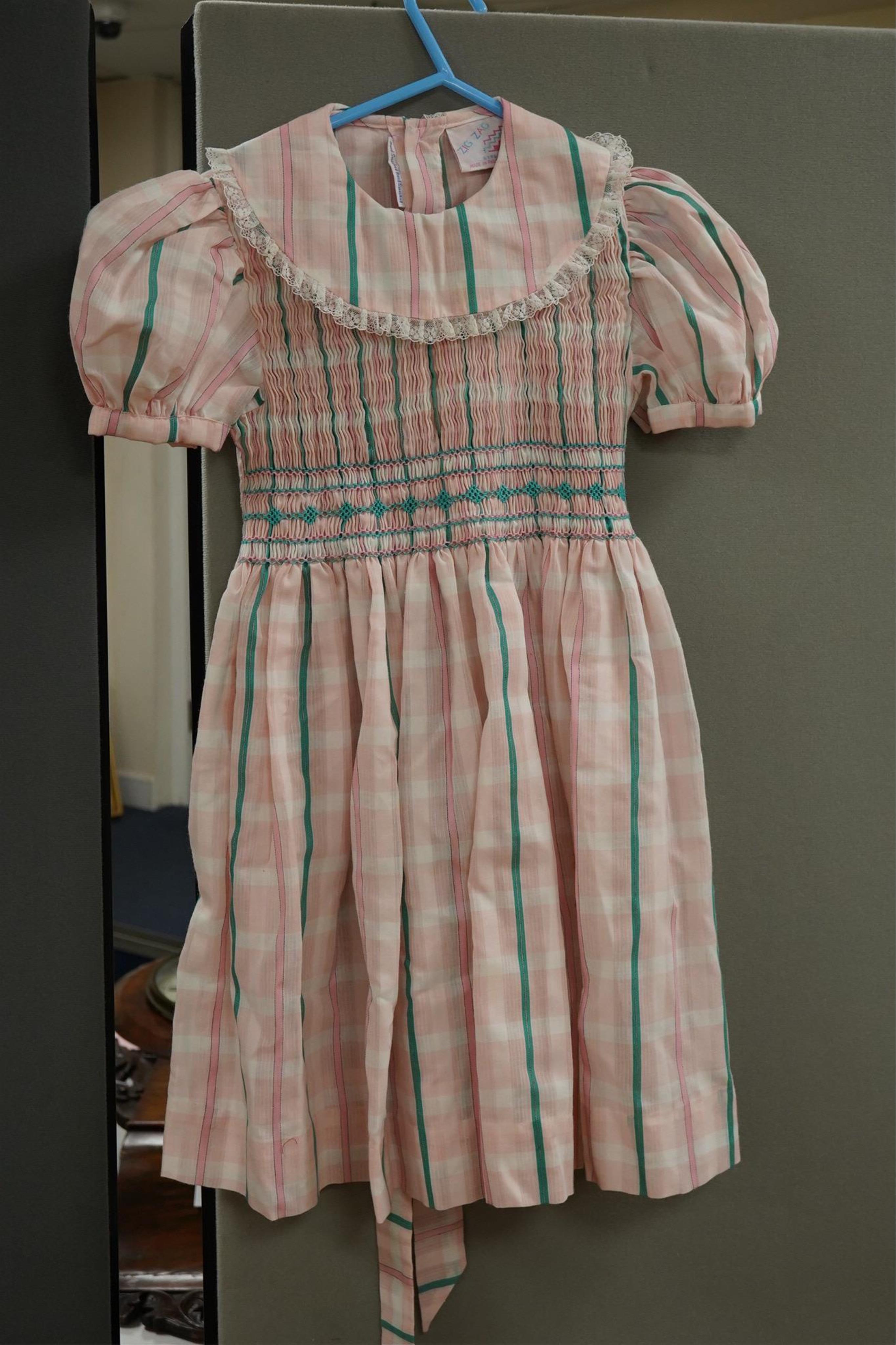 Twelve assorted 1980’s vintage children's dresses up to age eight, some hand smocked to include Harrods Belart, Chantel (including bell in hem), Michael de Leon, Heskia